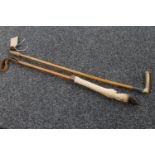 A vintage horn handled riding crop and a deer's hoof handled riding crop