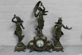 An antique French spelter and onyx figural clock garniture