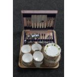 A tray of twelve Harleigh bone china trios and a canteen of stainless cutlery,