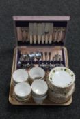 A tray of twelve Harleigh bone china trios and a canteen of stainless cutlery,