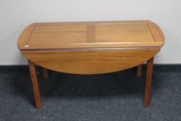 A continental mahogany flap sided coffee table