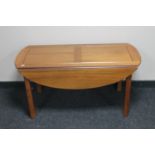 A continental mahogany flap sided coffee table