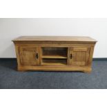 A contemporary oak entertainment unit