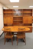 A seven piece teak G Plan dining room suite - twin section display unit,