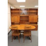 A seven piece teak G Plan dining room suite - twin section display unit,