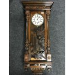 A mahogany cased eight day Vienna wall clock with enamelled dial,