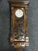 A mahogany cased eight day Vienna wall clock with enamelled dial,