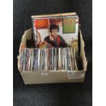 A box of LP records and 7" singles - 80's,