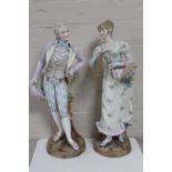 A pair of antique continental bisque figures