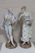 A pair of antique continental bisque figures