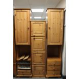 A pine bed surround fitted storage cupboards