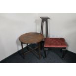 A pink dralon upholstered dressing table stool together with a circular oak occasional table and an