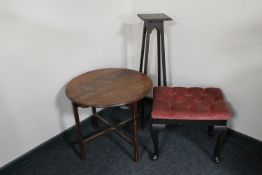 A pink dralon upholstered dressing table stool together with a circular oak occasional table and an