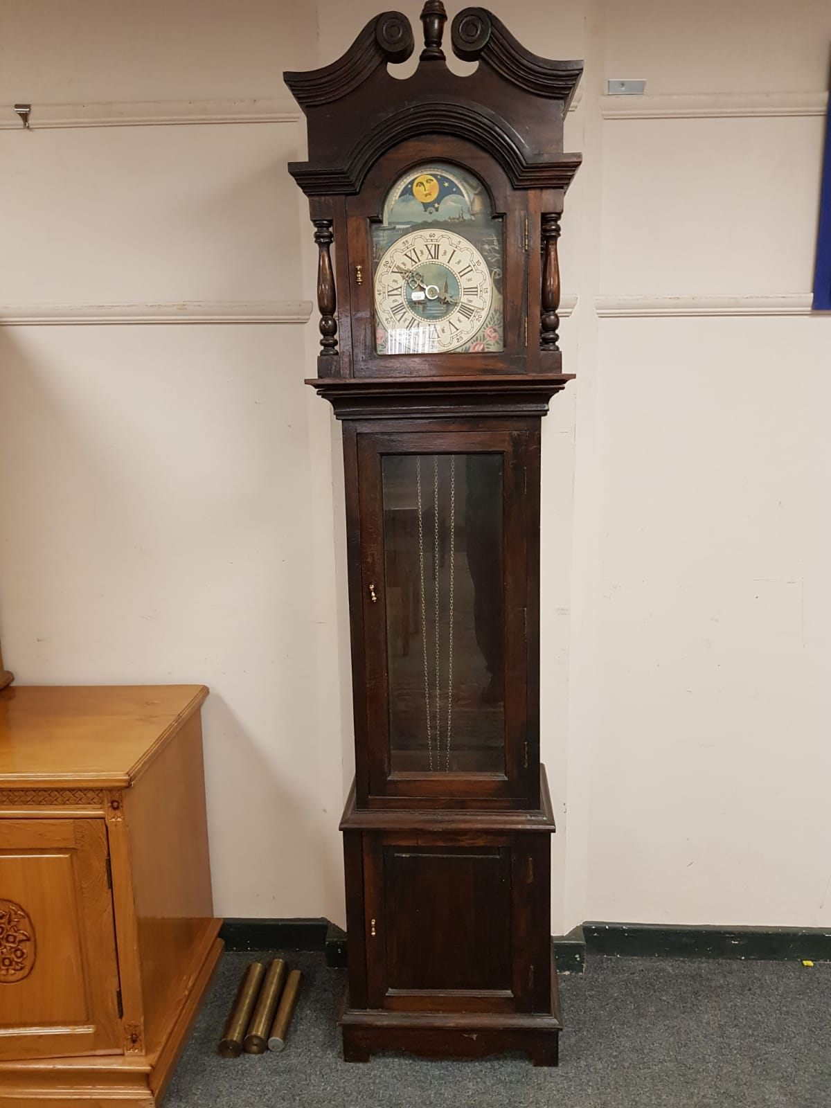 A 20th century stained pine longcase clock with moonphase dial,
