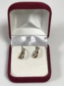 A pair of 9ct gold diamond set earrings with post fittings