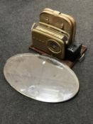 An early 20th century brass framed mirror, twin handled serving tray, Bush radio,
