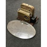 An early 20th century brass framed mirror, twin handled serving tray, Bush radio,