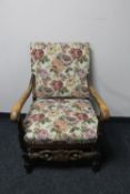 A beech framed armchair in tapestry fabric