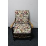 A beech framed armchair in tapestry fabric