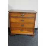 A late 19th century oak shaped front four drawer chest