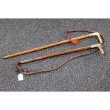 An antler handled sword stick and similar riding whip CONDITION REPORT: Blade 52cm