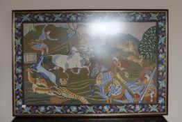 A framed wool work panel depicting Indian hunters on horseback