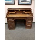 An Edwardian oak roll top desk,