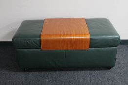 A Ekornes storage green leather double footstool with beech table insert