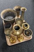 A tray of assorted brass ware to include Eastern brass planter and vases, pair of candlesticks,