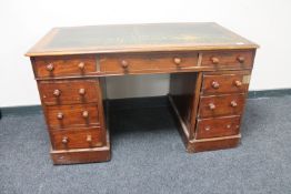 A Victorian mahogany twin pedestal desk fitted nine drawers