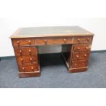 A Victorian mahogany twin pedestal desk fitted nine drawers