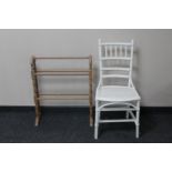 A painted bamboo and wicker bedroom chair plus a towel rail