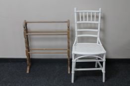 A painted bamboo and wicker bedroom chair plus a towel rail
