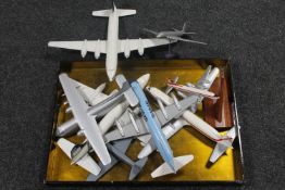 A lacquered twin handled serving tray containing a collection of wooden model aircraft