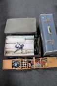 Three vintage luggage cases, two bottles of ginger wine, wall paper,