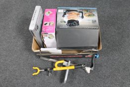 A box containing a Daewoo halogen oven, DVD player,