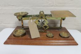A set of Victorian brass postal scales with weights