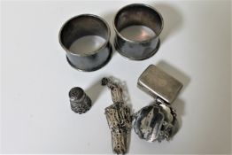 Two sterling silver napkin rings together with a thimble stamped 925,