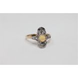 An 18ct gold opal and diamond ring