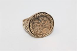 A 9ct gold ring set with a coin stamped 9ct CONDITION REPORT: 4.