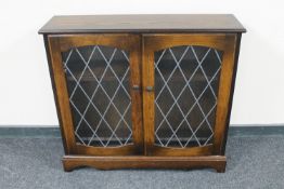 An oak effect leaded door bookcase