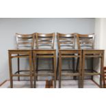 A set of four wooden bar chairs
