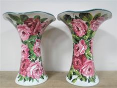 A rare very large pair of Wemyss vases decorated with cabbage rose sprays,