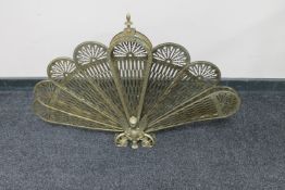 A 20th century brass fan fire screen