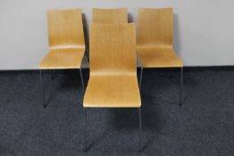 A set of four contemporary beech dining chairs