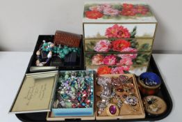 A tray of four drawer jewellery chest and costume jewellery,