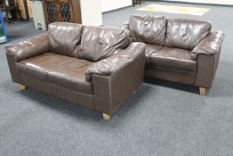 A pair of brown leather two seater settees