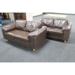 A pair of brown leather two seater settees