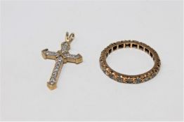 A 9ct gold synthetic spinel eternity ring and a 9ct gold crucifix pendant CONDITION