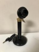 A Bakelite candlestick telephone